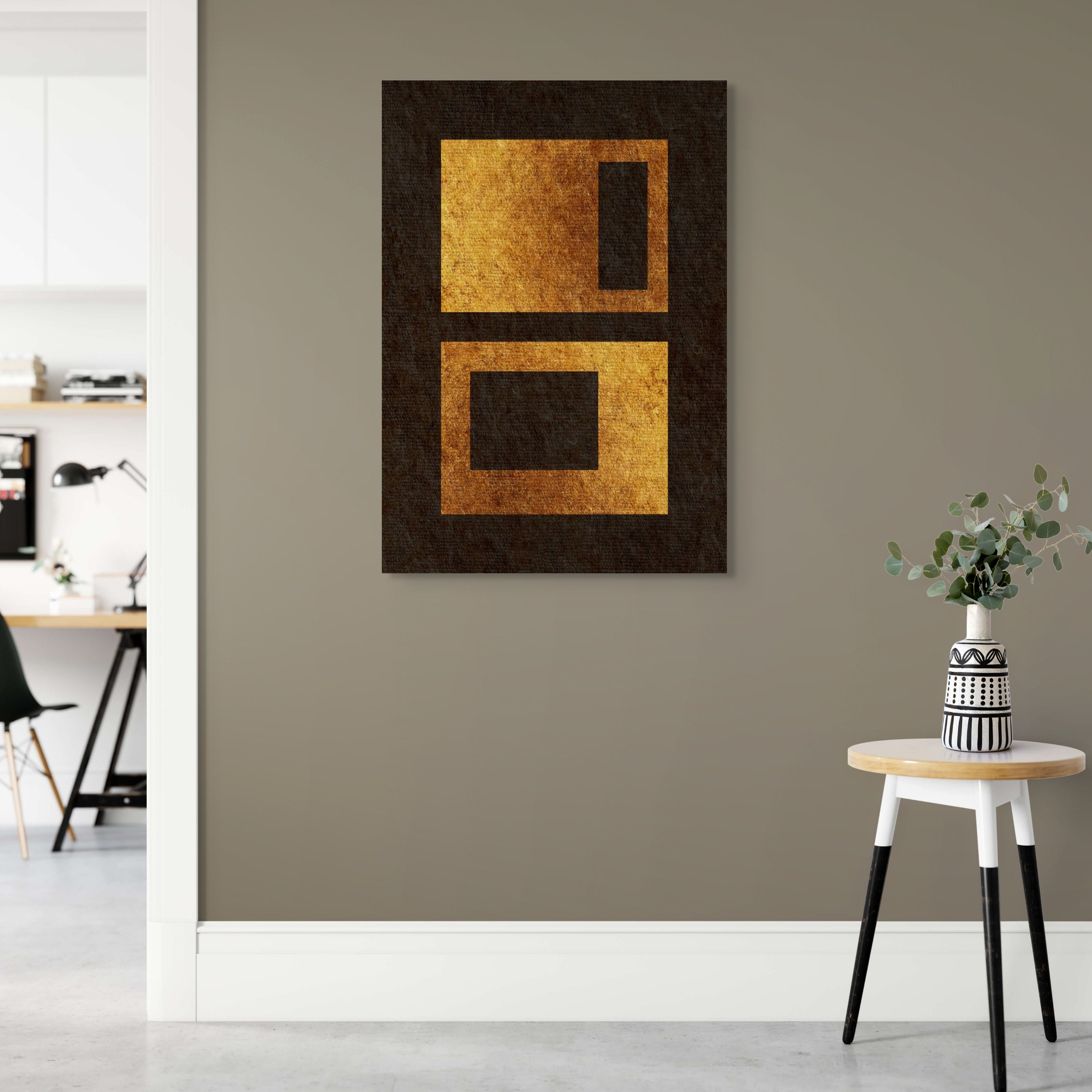 Settled Forms geometric abstract print displayed in a calm modern interior, showing textured gold rectangular forms on a dark background.