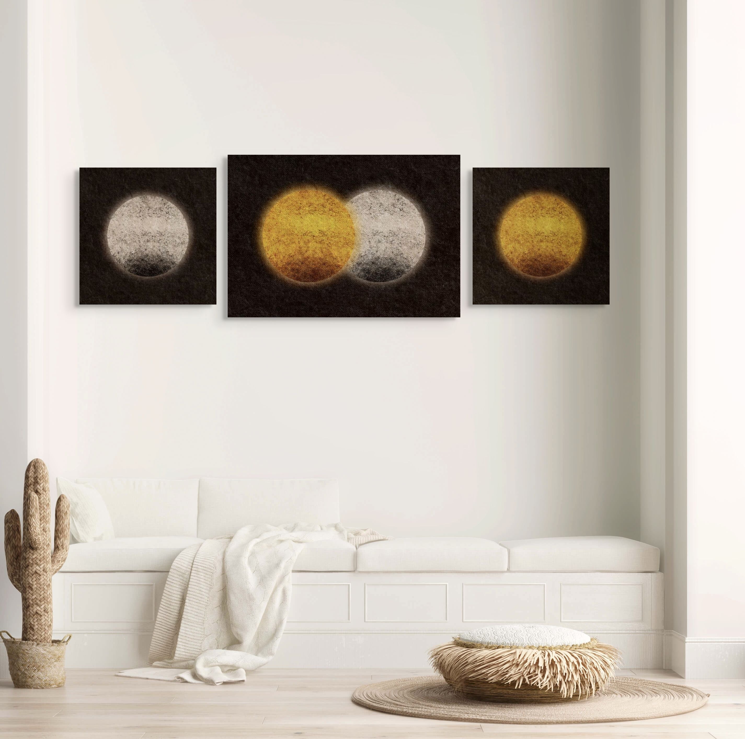 Between States collection mockup with three abstract textured prints in gold, white, and black, styled in a minimalist neutral interior above a white bench.