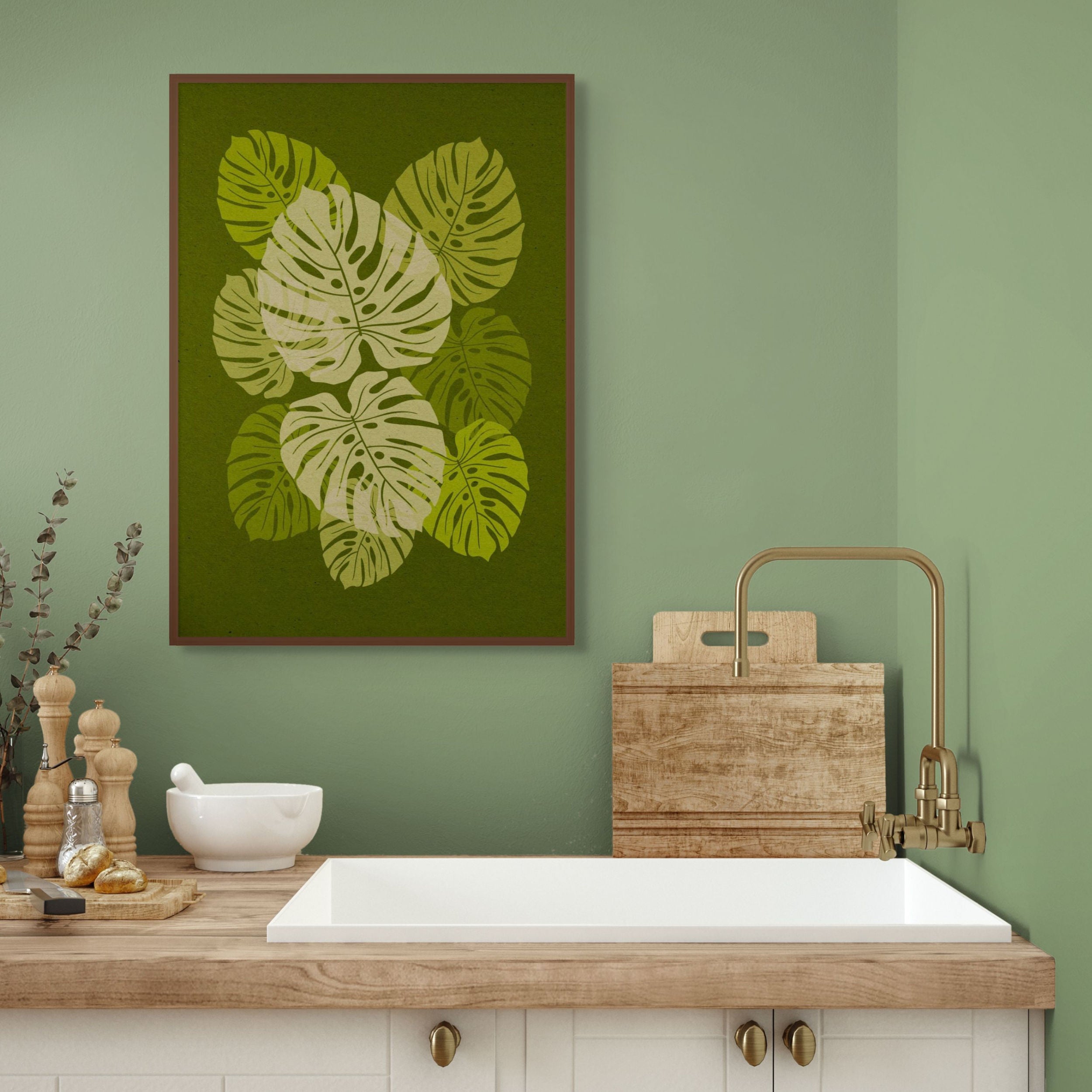 Canopy green botanical wall art hanging in a calm kitchen interior with natural wood and soft green walls