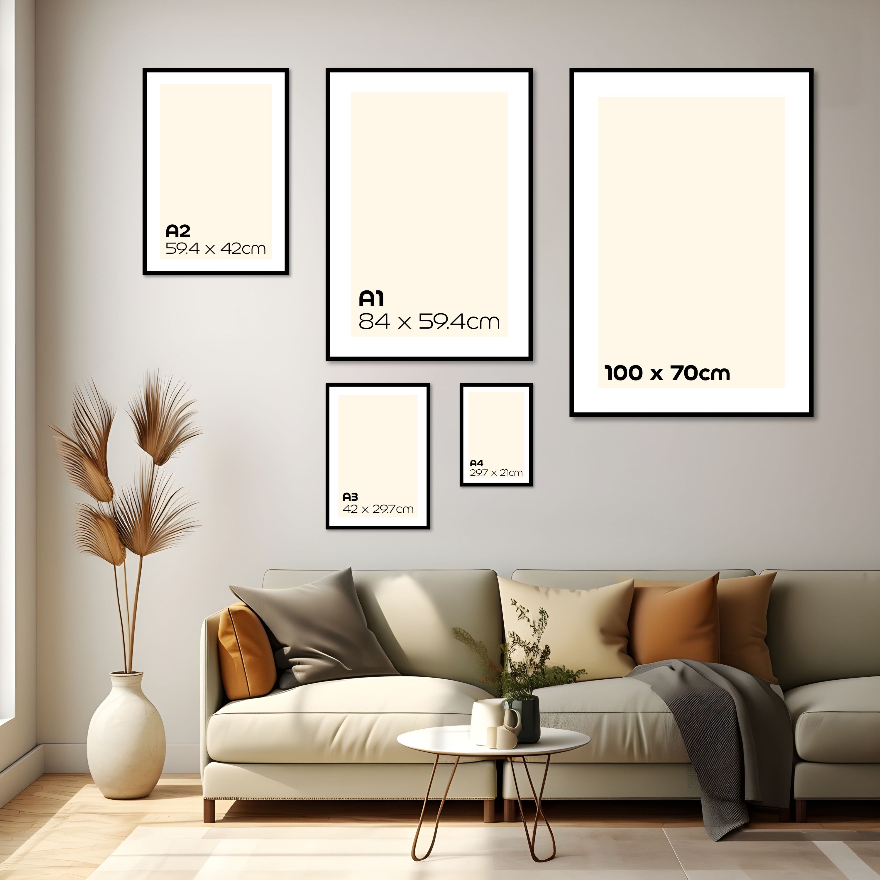 Wall display size guide showing framed print dimensions A4, A3, A2, A1, and 100 × 70 cm arranged above a sofa in a neutral modern interior.
