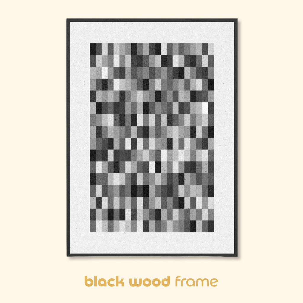 Framed monochrome geometric abstract print in black wood frame displayed against neutral background.