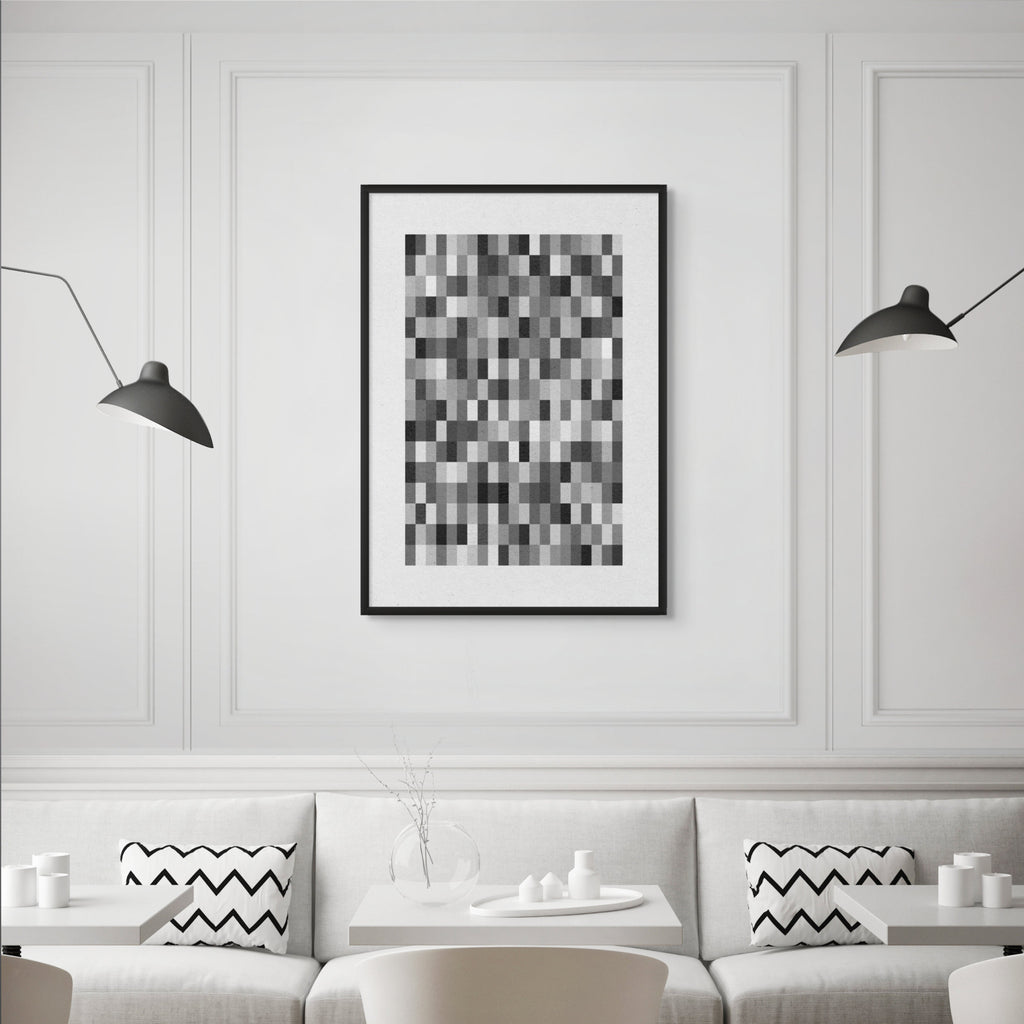 Minimalist geometric black and white print displayed in bright contemporary café style interior.