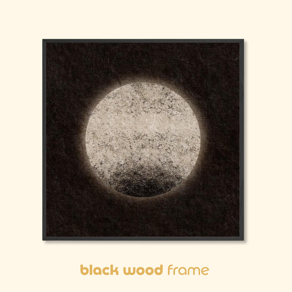 Moon-inspired abstract art print with a pale circular form and vintage textured surface, displayed in a black wood frame on a light background.