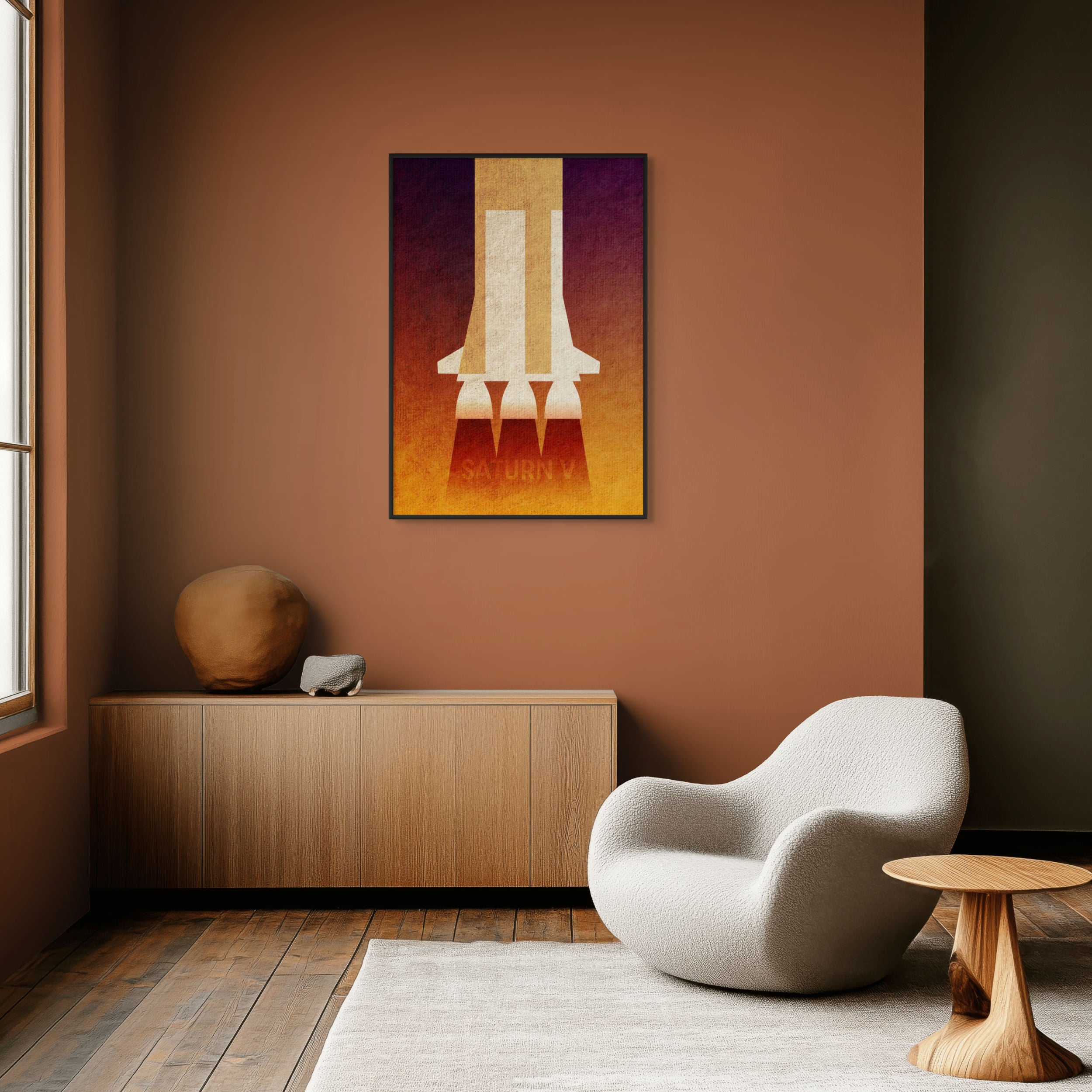 Saturn V minimalist rocket art print displayed in a modern living room with mid-century style furniture.