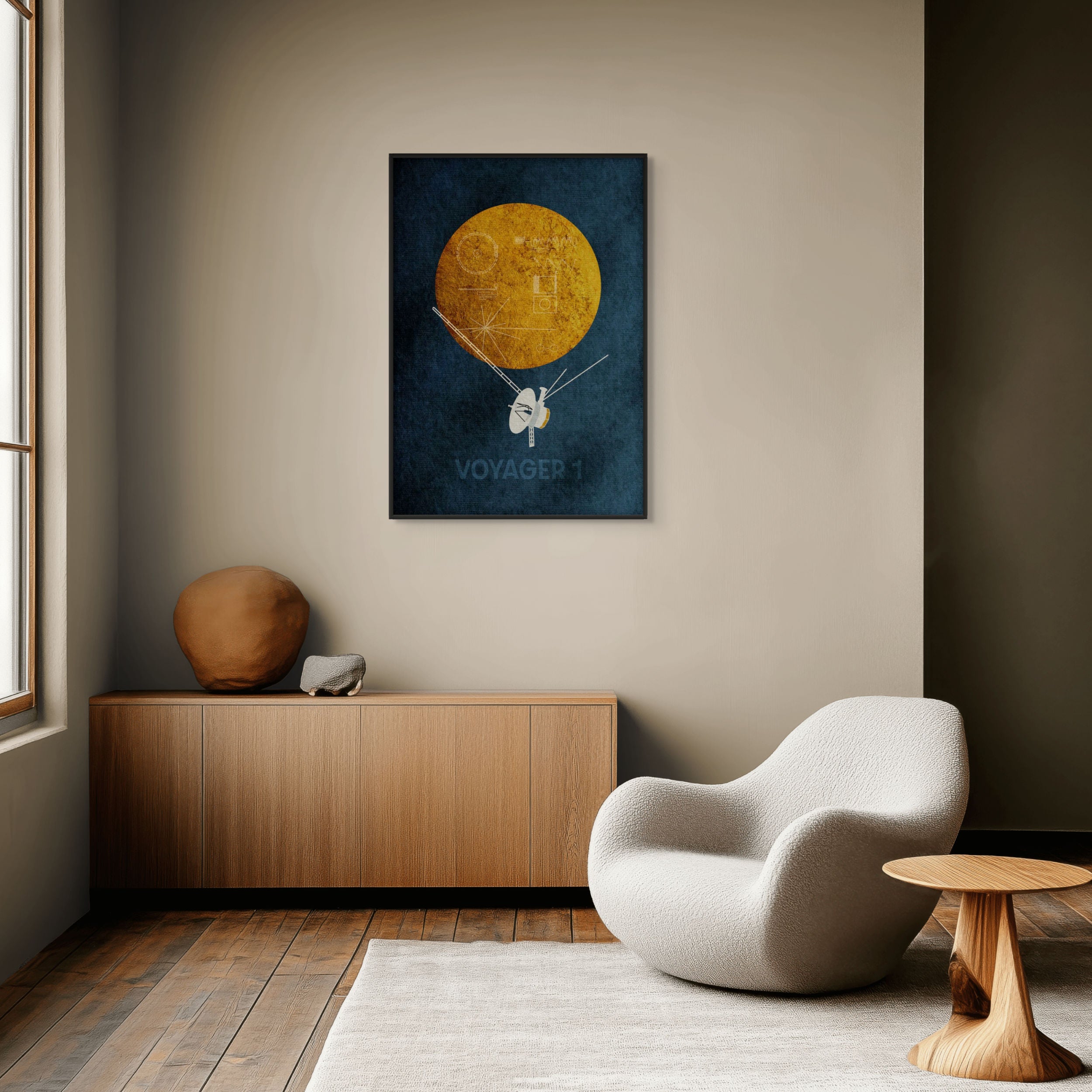 Voyager 1 minimalist space art print displayed in a modern living room with mid-century style furniture and neutral tones.